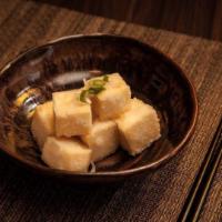 Agedashi Tofu · Deep fried tofu with sauce, bonito flakes and scallions.