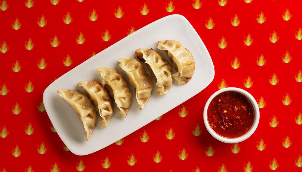 Spicy Potstickers · Pan fried pork filled dumplings with a house soy sauce.