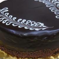 *Chocolate Truffle Torte · Chocolate cake filled with truffle filling covered in dark chocolate ganache (We can write a...