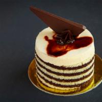 Le Desir · White sponge cake with chocolate mousse and caramel mousse, with a cinnamon glaze