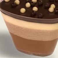 Le Chocolat · Layers of milk, white, and dark chocolate mousse topped with a thin layer of ganache, topped...