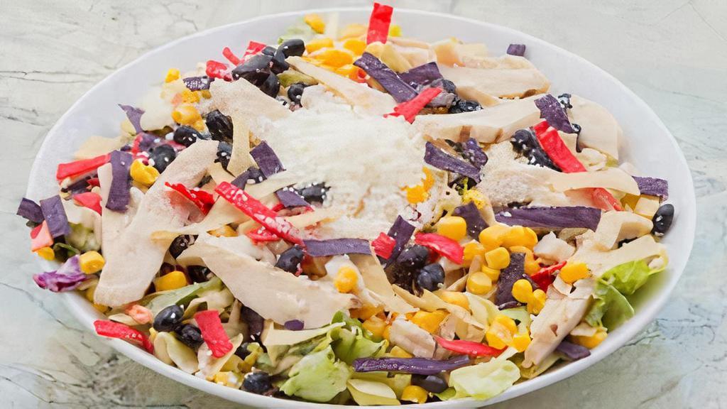 Southwestern Salad · Garden Mix  with Corn, Black Beans, Avocado, Tortilla Strips, Cotija Cheese and Chipotle Vinaigrette Dressing.