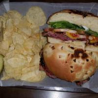 Hot Pastrami · Pastrami, Jack Cheese, Lettuce, Tomato, Mayo, & Mustard on an Onion Roll.   Served with Pick...
