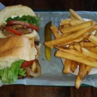 Steak Sandwich · New York Strip, Lettuce, Tomato, Grilled Onions and Mayo on a French roll.   Served with Pic...