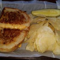 Grilled Cheese · Three Slices of American or Cheddar Cheese between Two Buttered Slices of Grilled Sourdough ...