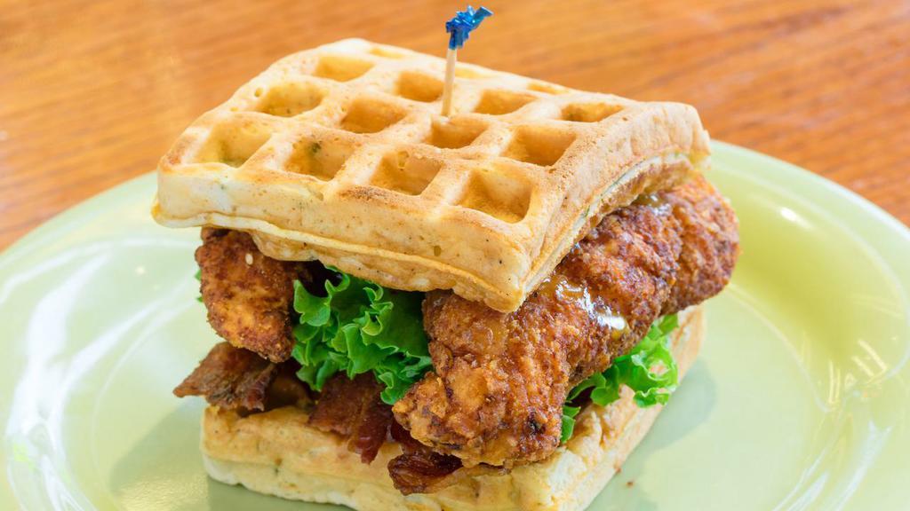 Chicken & Waffles · Classic tenders with bacon, lettuce and tomato on a cheddar and green onion waffle with maple mustard sauce. Served on waffle.