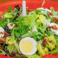 Cobb · Mixed greens, chicken, blue cheese, avocado, hard-boiled egg and bacon with choice of dressi...