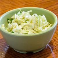 Classic Coleslaw · Classic - Shredded cabbage and carrots with our olive oil, vinegar, red onions,jalapeño, and...