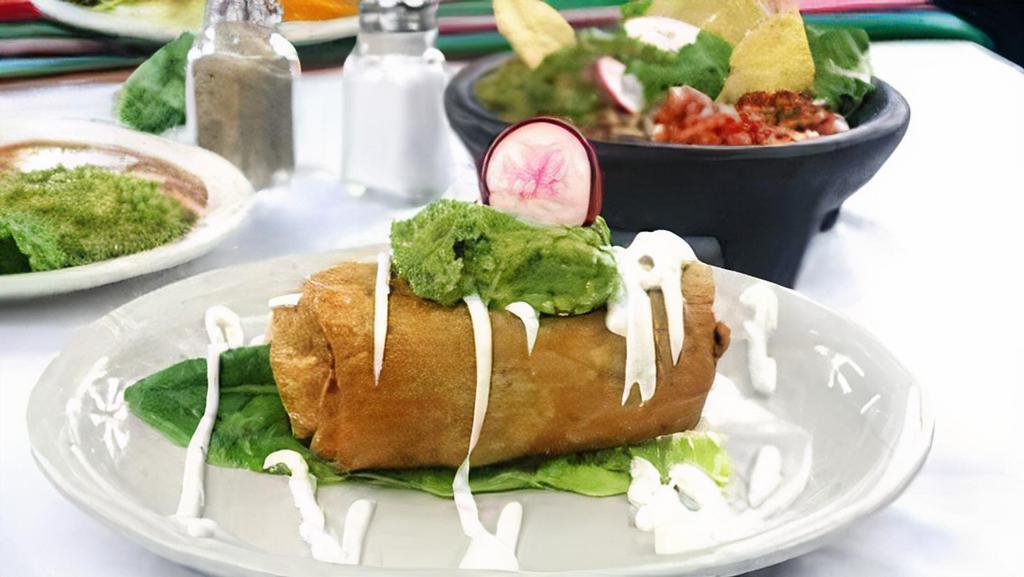 Chimichanga · Fried burrito includes rice, beans, your choice of meat, and cheese. Also includes side sour cream side guacamole