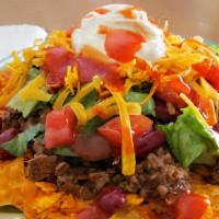 Taco Salad · Choice of meat, chips, beans, vegetables, cheese, and sour cream.