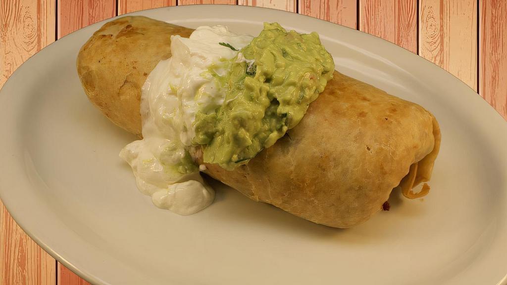 Chimichanga · Fried Burrito with cheese inside and guacamole, sour cream on the side