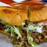 Torta · Choice of meat, beans, lettuce, tomatoes, onions, and cheese.
