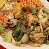 Fajitas De Camaron · Rice, bean,s corn tortillas, grilled shrimp,  grilled bell peppers, grilled onions.