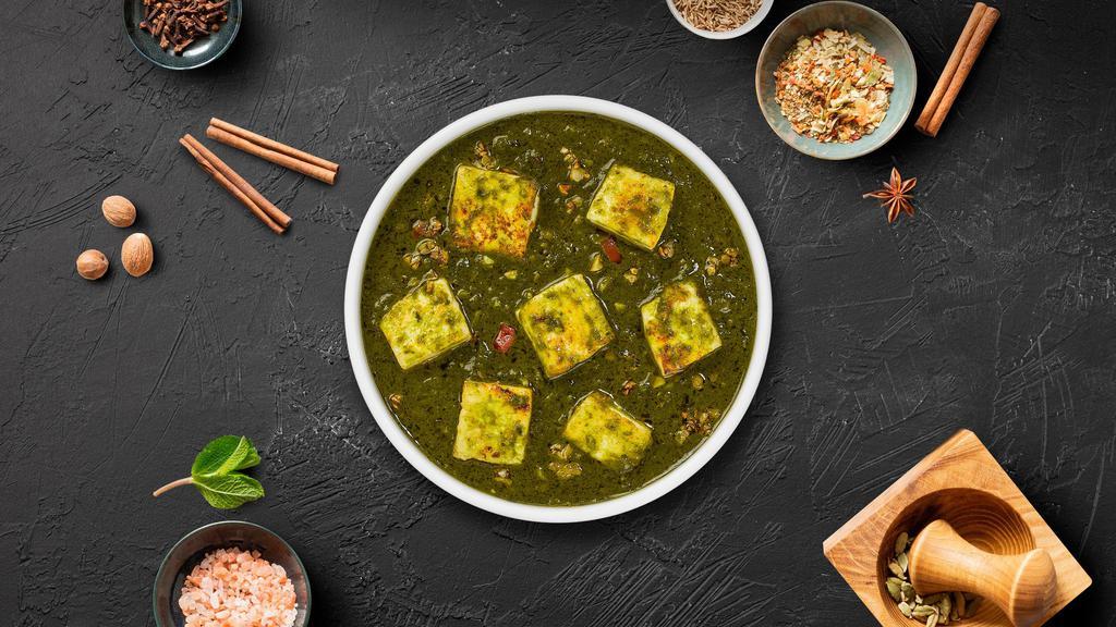 Saag Paneer · Cubes of fresh cottage cheese cooked in a spinach gravy infused with garlic, ginger, and spices.