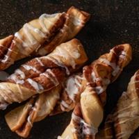 Cinnamon Twists · Our famous twists, rolled in a brown and white sugar cinnamon mixture and topped with a deli...