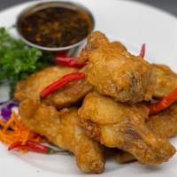 Chicken Wings · (8) deep fried tempura chicken wings sautéed with chili and garlic sauce tossed with house B...