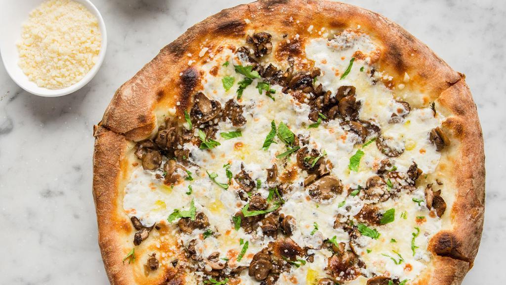 Mushroom Pizza · Crimini mushrooms, mozzarella, roasted garlic cream, grana padana, herbs