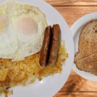 Sausage and Eggs · Served with two eggs, homemade country potatoes, buttered toast, and jam.