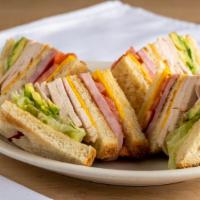 Club Imperial Sandwich · Triple decker with turkey, ham, avocado, lettuce, tomatoes, and American cheese.