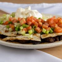 Steak Quesadilla  · Includes bell peppers, mushrooms, onions, avocado, and cheese.