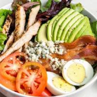 Cobb Salad · Hearty salad packed with protein.. Organic greens, grilled chicken breast, bacon, avocado, e...