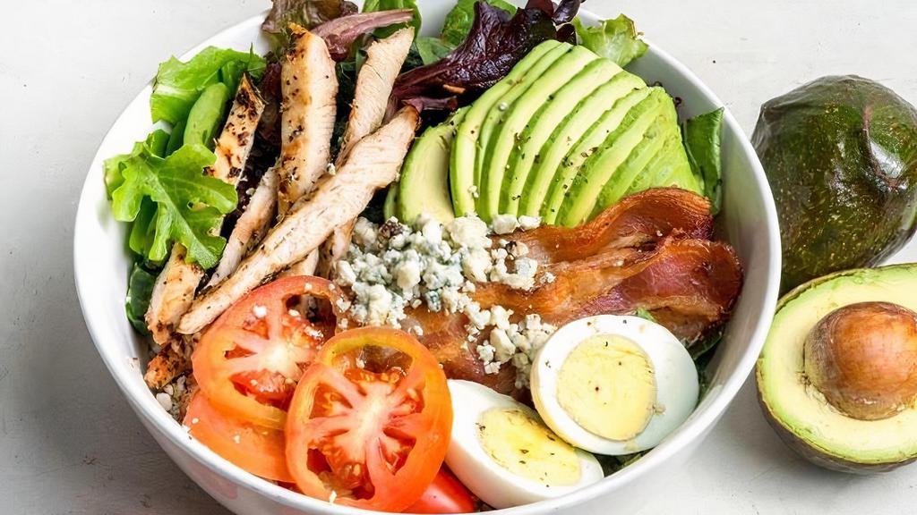 Cobb Salad · Hearty salad packed with protein.. Organic greens, grilled chicken breast, bacon, avocado, egg, cherry tomato, bleu cheese dressing, bleu cheese crumbles