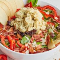 Curried Chicken Salad · Fresh organic greens, curried chicken salad, red peppers, bacon, slivered almonds, sliced ap...