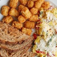 Veggie Scramble · Soft cooked eggs with sauteed spinach, roasted peppers, cotija cheese, Served w/toast & tots