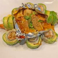 Crazy Atomic · Shrimp tempura & crabmeat topped with avocado & baked assorted fish in middle.