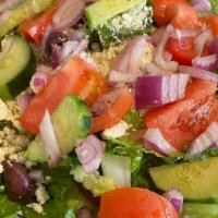 Greek Salad · Romaine lettuce, tomatoes, onions, feta, kalamata olives and cucumbers.