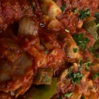 Chicken Cacciatore · Half chicken with sautéed mushrooms , onions and bell peppers in a marinara sauce. Served wi...