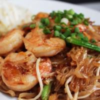 Shrimp Pad Thai · Rice noodles stir fried with egg, shrimps, tofu and bean sprouts topped with ground peanut.