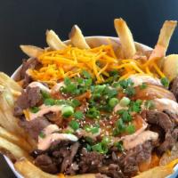 Korean Loaded Fries · Caramelized kimchi, grilled steak, Cheddar cheese, samourai sauce, green onions and sesame s...