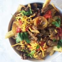 Philly Cheesesteak Loaded Fries · Yup, just like Philly cheesesteak, this unit has melty Cheddar cheese with grilled steak, gr...