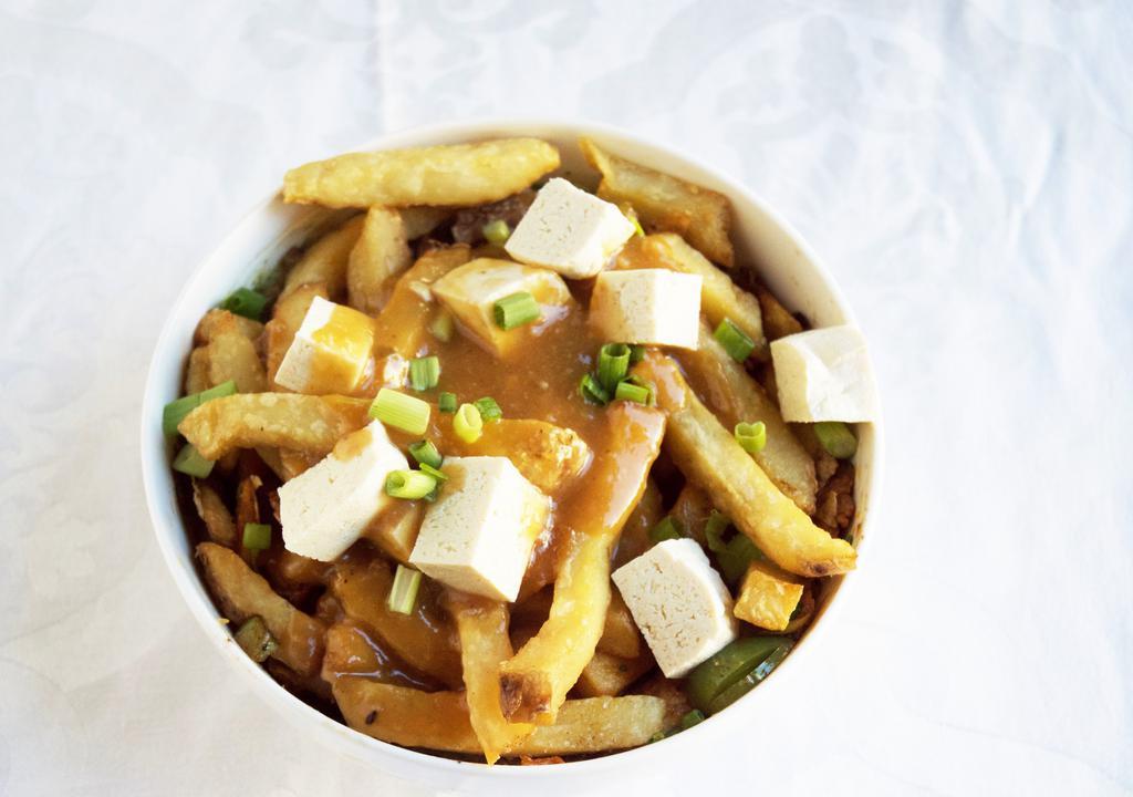 Vegetarian Poutine Loaded Fries · Our delicious recipe calls for an intense mushroom broth base and it is served with Cheddar curds.