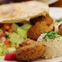 Falafel Plate · Vegan. Four hot and fresh falafel patties served with a side of garden salad, hummus, baba g...