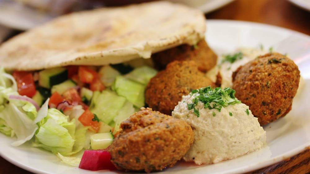 Falafel Plate · Vegan. Four hot and fresh falafel patties served with a side of garden salad, hummus, baba ghanough, pickles, and pita bread.