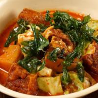 Home-Made Penang Curry (Gaeng Penang) · A rich, home-made red coconut milk curry spiced with nutmeg and mace, with makrut lime leave...