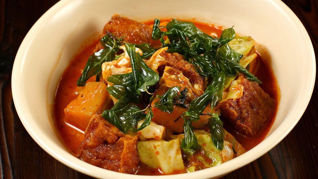 Home-Made Penang Curry (Gaeng Penang) · A rich, home-made red coconut milk curry spiced with nutmeg and mace, with makrut lime leaves. Sweetened with palm sugar, then simmered with pumpkin, cabbage, and basil. Your choice of fried tofu, chicken or shrimp.