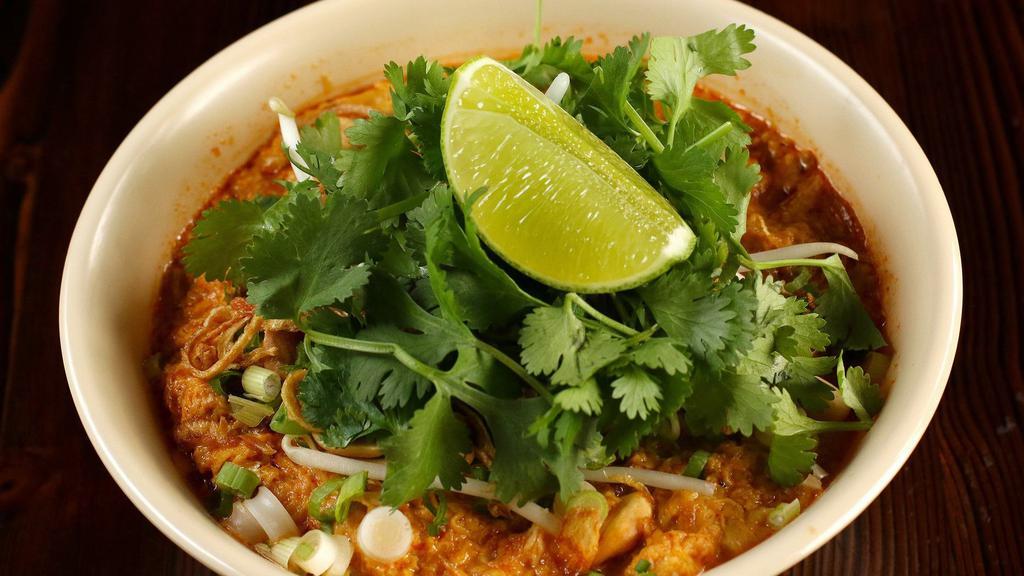 Tamarind Egg Drop Curry Noodles with Peanuts (Mee Kati) · Vegetarian. Flat rice noodles in a rich egg drop curry broth seasoned with peanuts, fermented bean paste, and tamarind, garnished with bean sprouts, green onions, cilantro, and fried shallots.