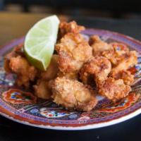 Fried Chicken (Gai Tod) · Isaan-style: boneless chicken thighs marinated, fried in a rice flour batter and served with...