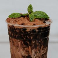 MiloDằm · Dark cacao Milk topped with a chocolate swirl, boba, milo powder, and coco puffs.