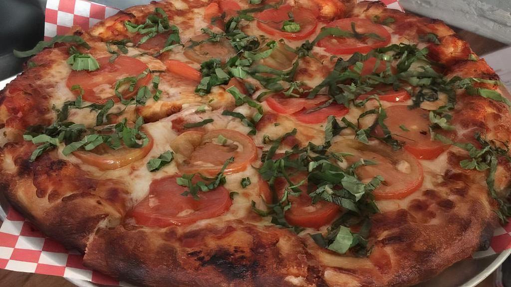 Margherita · house red sauce, fresh basil, sliced roma tomatoes, & five cheese blend
