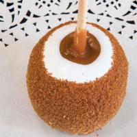 Apple Pie Apple™ · Caramel-covered granny smith apple dipped in white confection, rolled in brown sugar and cin...