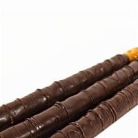 Peanut Bear on a Stick · Pretzel rod covered with caramel and topped with chopped peanuts drizzled with white and mil...