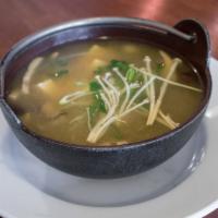 Kinoko Miso · Miso soup with portobello, shimeji, eryngii mushrooms, tofu, scallions, and kaiware sprouts.