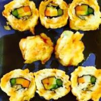 Cha-Ya Roll · The entire sushi roll, filled with asparagus, yam, avocado, and carrots, is lightly battered...