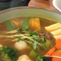 Vege-Tofu Curry · Curry soup topped with tofu, kabocha, onions, celery, carrots, broccoli, cauliflower, zucchi...