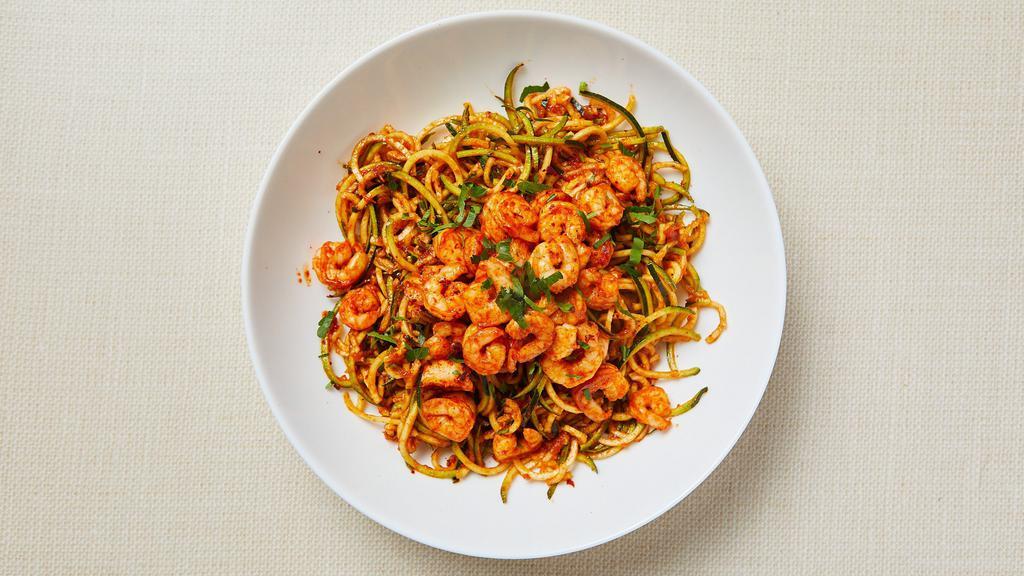 Paleo Shrimp Marinara Zoodle · Pan roasted zucchini noodles served with homemade tomato sauce and spicy garlic shrimp. Gluten-free. Dairy-free.