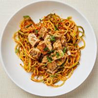 Paleo Chicken Marinara Zoodle · Pan roasted zucchini noodles served with homemade tomato sauce and grilled spicy chicken thi...